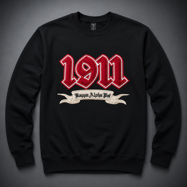 Custom black crewneck sweatshirt with oversized dimensional crimson old English founding year appliqué and cream banner scroll with organization name below.