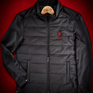 Custom embroidered black hybrid quilted performance jacket with crimson diamond insignia and Greek letter abbreviation on left chest, reflective cuff and hem details, multi-pocket system.