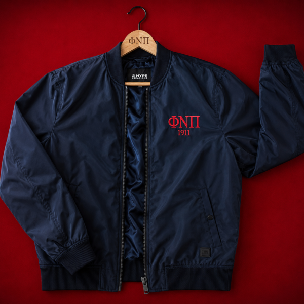 Custom embroidered black shell bomber jacket with crisp Greek letter abbreviation and founding year in crimson thread on left chest, full-length center zip, and ribbed finishing.