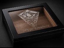 Black glass-top humidor with an etched diamond insignia on the lid and cedar interior