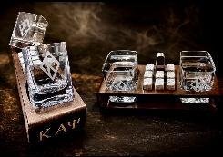 Engraved crystal cigar whiskey glass and decanter with whiskey stones in an open wood presentation case marked KAP
