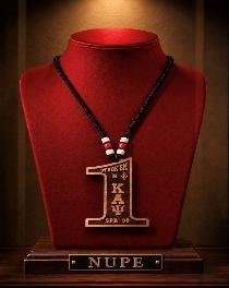 Beaded tiki necklace with a carved wood pendant on a red display bust with a NUPE engraved base
